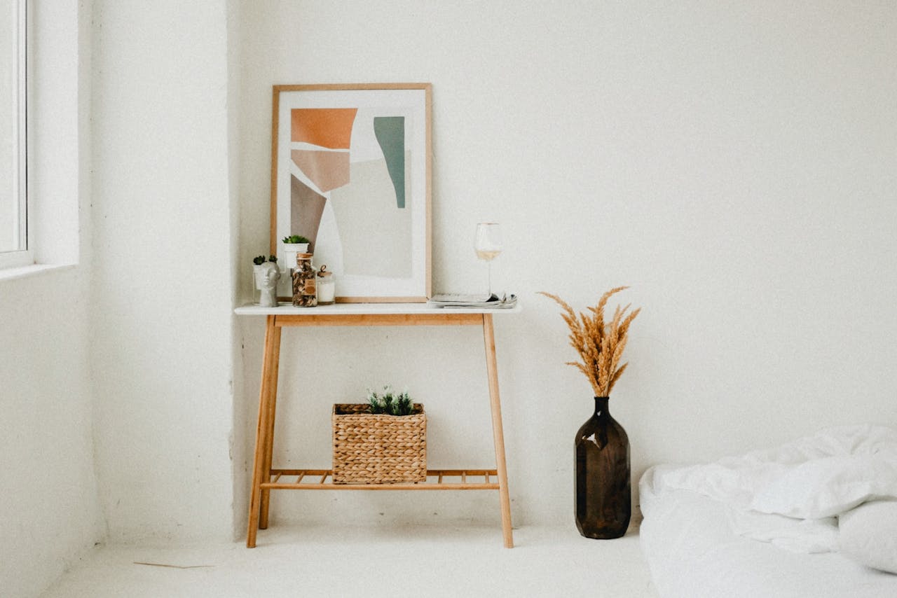 services-img Elegant minimalist decor featuring pampas grass and wooden table in a bright interior space.